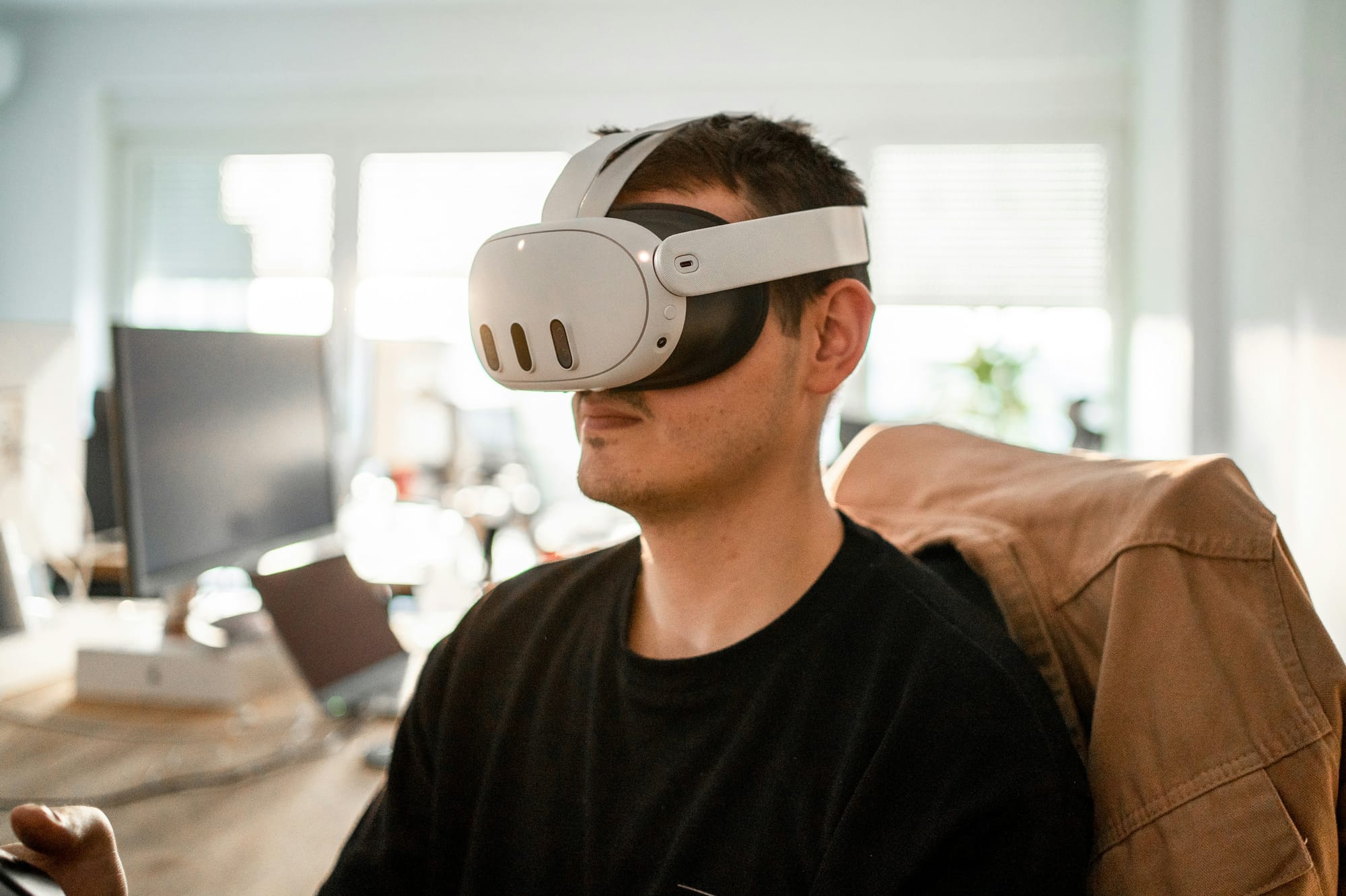 person in office chair with vr - Oculus For Work