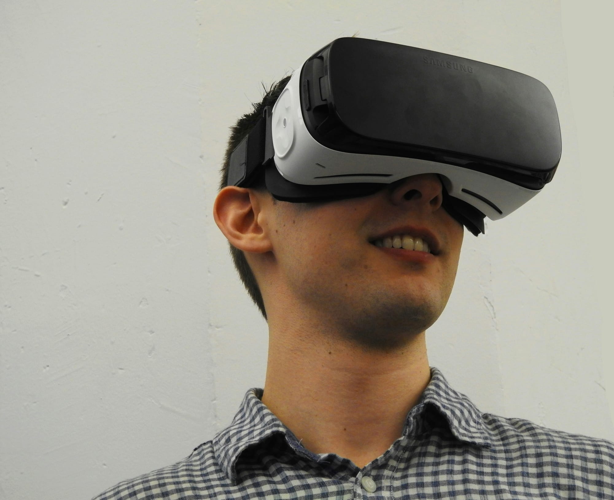 man wearing and enjoying VR Headset For Office Work