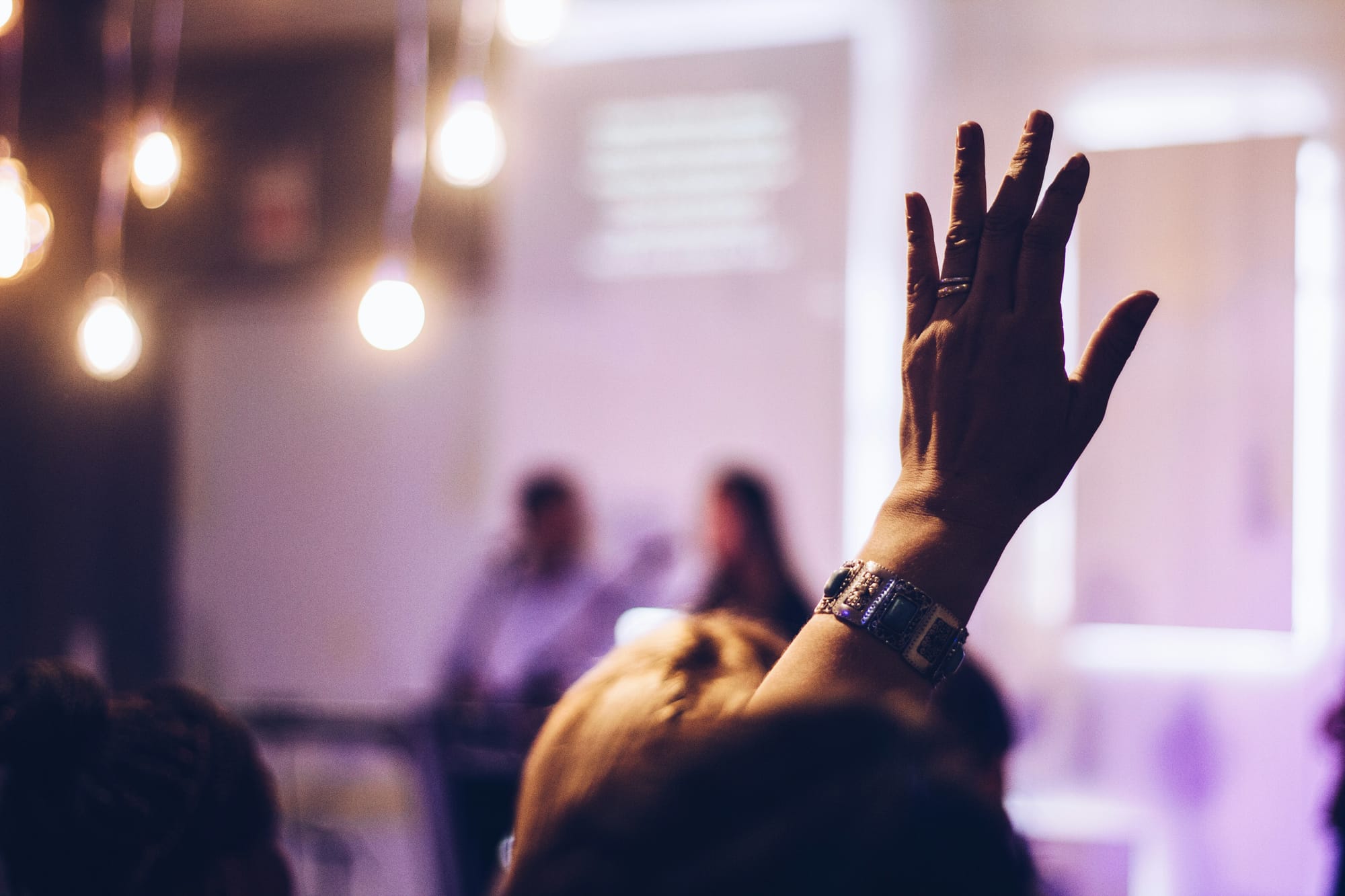 woman asking question in a seminar - Virtual Reality Presentation