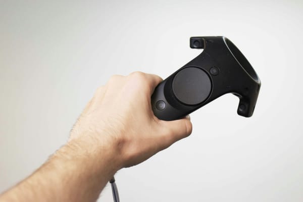 person holding joystick of vr - play oculus games on gear vr